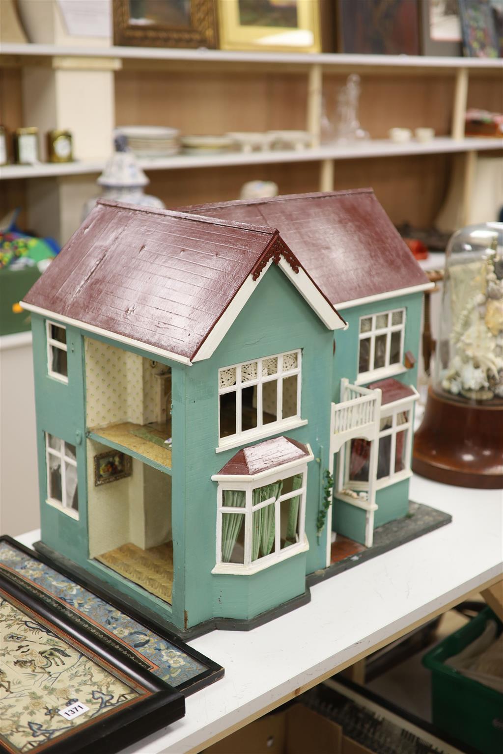 A 1940s dolls house, with contents from Compton Verney Warwickshire, width 63cm height 60cm